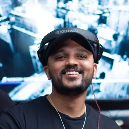 A happy shot from behind the decks. I'm ready to spin the best of hip-hop and commercial tunes for an unforgettable evening.
