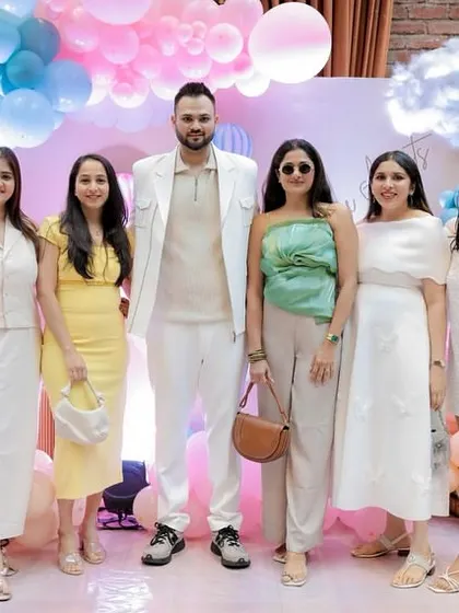 The parents-to-be posing with their guests. A beautiful backdrop ensures every photo from the day is a keeper.