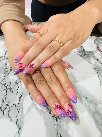 An amazing piece of student work. This set features a beautiful purple and pink ombre with delicate, feathery art.