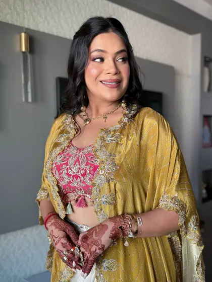 The client looking radiant and happy, ready for her pre-wedding event.