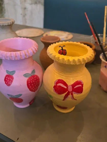 Look at these adorable finished vases. From cute strawberries to a simple bow, you can paint anything that you imagine. You get to take home these beautiful, usable souvenirs from your date.