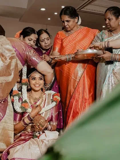 A beautiful moment from a traditional ceremony. The bride's makeup is flawless even from a distance, ensuring she looks her best from every angle throughout the day.