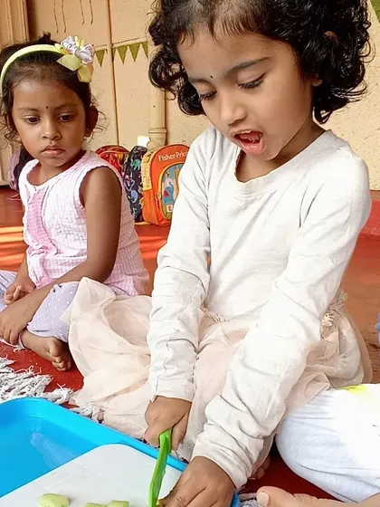 Making a healthy and delicious chickpea salad, where children practiced chopping vegetables and mixing ingredients to create a nutritious meal.