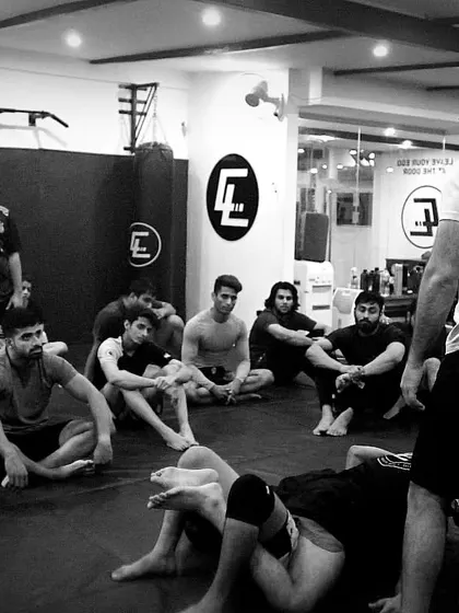 A black and white shot of me teaching a class. The principle is simple: Jiu-Jitsu is for everyone, and our job is to make high-level concepts accessible to all who are willing to learn.