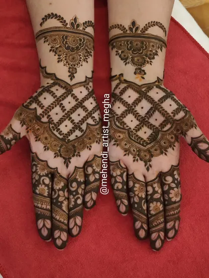 A lovely design featuring a large net pattern on the back of the hand, balanced with delicate floral work on the fingers and wrist.