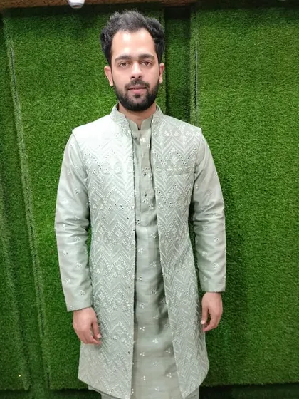 This customer is wearing a light green Indo-Western set with a long embroidered jacket over a matching kurta. It's a comfortable yet very stylish outfit for mehendi or sangeet.
