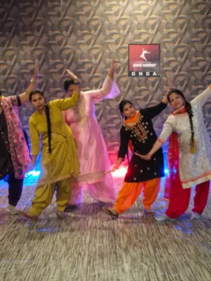 A group of ladies posing after a fun and intensive Bhangra workshop.