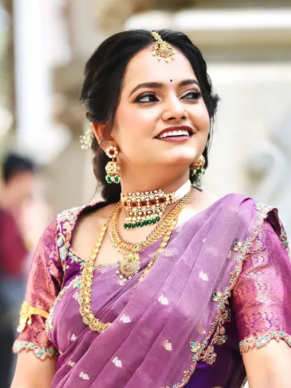 A beautiful smiling shot of Rashmika. Her makeup is fresh and youthful, perfect for her engagement celebration.