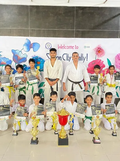 The full team from our Silicon City dojo with their haul of trophies and medals. Their collective success is a result of consistent training and teamwork.