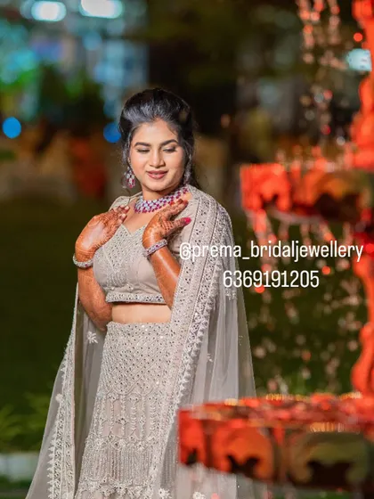 This bride chose a modern ruby and diamond-look choker set to pair with her elegant lehenga for her reception.