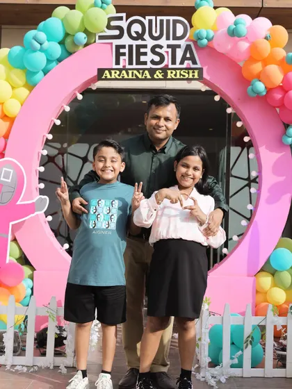 The birthday children with their father at the 'Squid Fiesta' party. Creating joyful moments for families is the best part of my job, and this photo captures that perfectly.