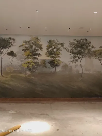 The completed forest mural in the large hotel space.
