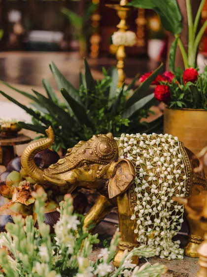 A detail shot of a brass elephant statue, a recurring motif in our traditional decor setups.
