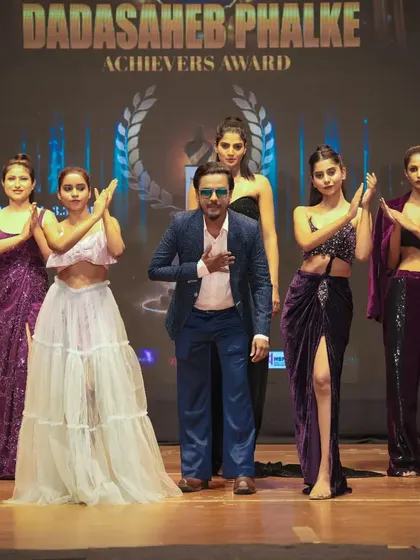 A moment of gratitude on stage with the models after a successful show at the Dadasaheb Phalke Awards. It's a team effort, and I take pride in the talented crew I assemble for each project.