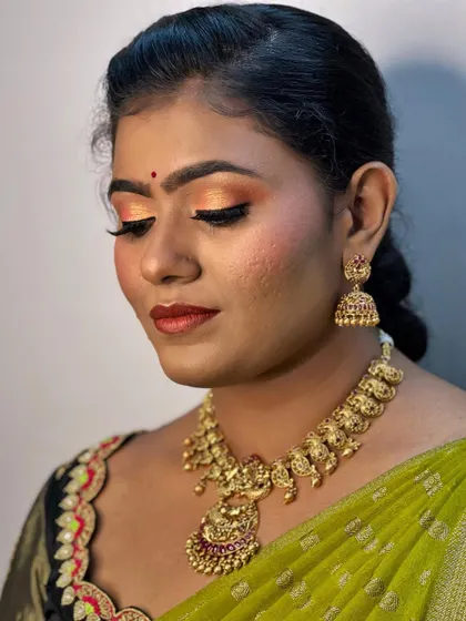 A close-up showing the shimmery sunset-toned eyeshadow. This look is perfect for a festive traditional event like a Gruhapravesha.