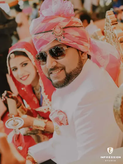 A candid moment of joy during a wedding ceremony in Jaipur. The groom's smile and the bride's happy glance show that even in the most regal settings, it's the genuine emotions that I love to capture.