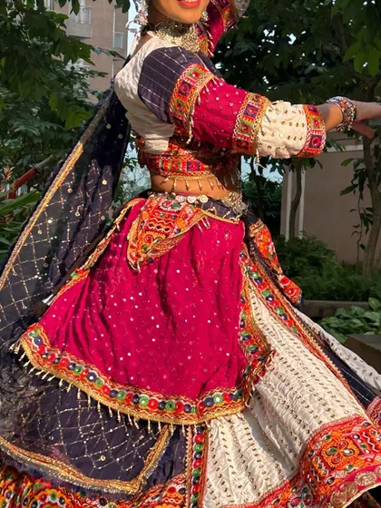 A close-up of the outfit in motion, showing the texture and sparkle of the fabric.