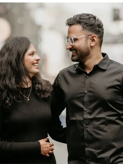 A happy, candid shot of a couple walking and talking together. This natural interaction is what I strive to capture, making your pre-wedding photos feel like a real, happy memory.