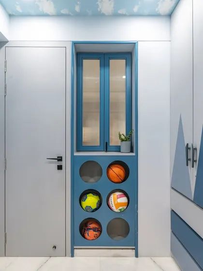 We designed this unique storage unit specifically for sports equipment. The circular cutouts are a fun and easy way for a child to store basketballs and soccer balls, keeping them off the floor and turning them into a decorative feature.