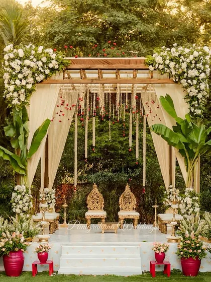 As architects turned designers, we love blending structure with nature. This elegant mandap features a clean wooden frame, traditional banana leaf pillars, and lush white florals, creating a serene and timeless look for a South Indian wedding.