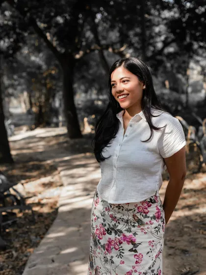 A beautiful solo portrait of the bride-to-be, capturing her natural smile and happiness during the pre-wedding session.