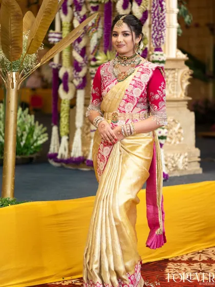A full-length shot showing the complete look for the sister of the bride, a perfect example of coordinated family styling.