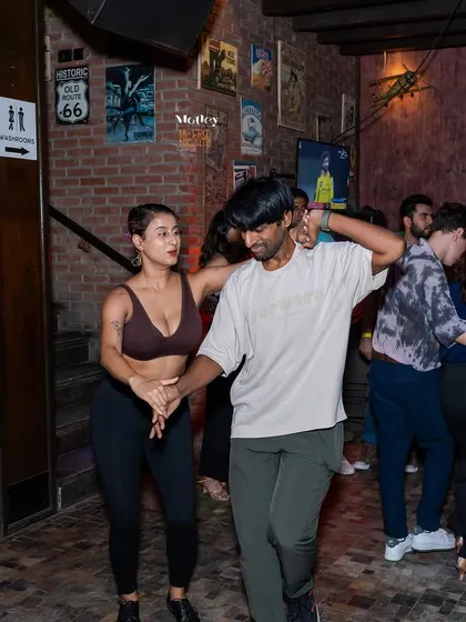 Focused and connected, this pair showcases the beautiful communication that happens during a dance. It’s a language everyone can learn.