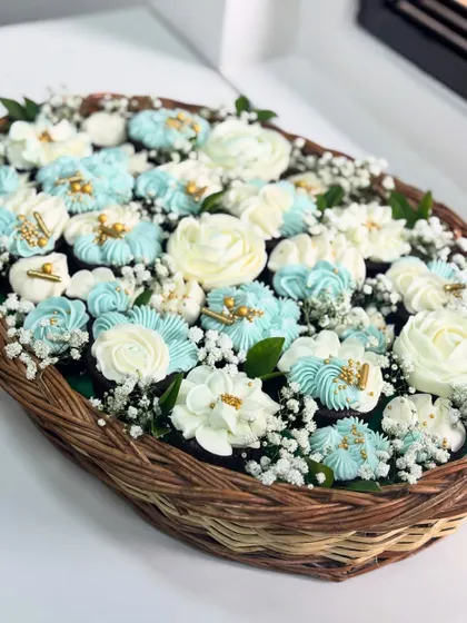 Is it a bouquet or a dessert? This is one of my favorite creations, a cupcake basket where every single flower is hand-piped with buttercream. It’s a perfect example of how I turn a simple treat into a piece of edible art, ideal for gifting.