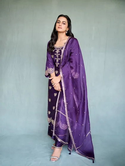 Shraddha Srinath looking radiant in this deep purple embroidered suit. It's a rich, royal color that’s perfect for evening events.