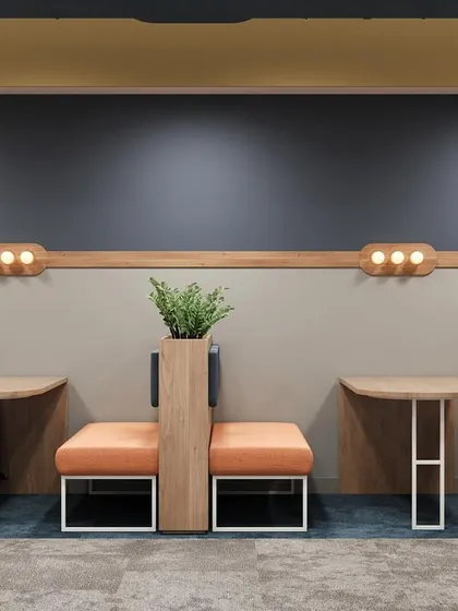 This render shows another breakout area design, featuring booth seating with integrated planters. The color scheme of muted orange and deep blue creates a calm yet sophisticated atmosphere.