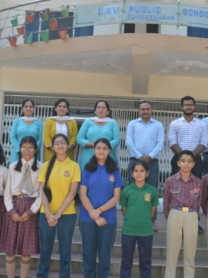 A group of student participants from the cybersecurity workshop at DAV Public School pose with their teachers.