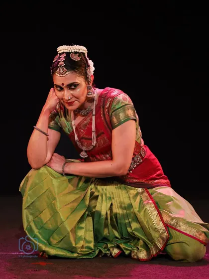 A pensive and thoughtful expression, capturing a moment of quiet contemplation within a performance.