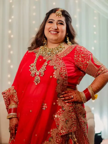 This bride is glowing for her reception. We opted for a soft glam makeup look with defined eyes and flowing hair, perfect for a night of celebration.
