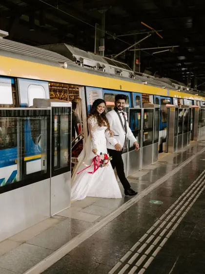 Love stories unfold in the most unexpected places. For this couple's post-ceremony shoot, we took to the Mumbai metro, creating a series of modern, unconventional portraits that reflect their fun-loving spirit against an everyday urban backdrop.