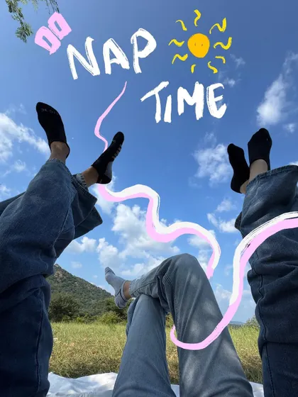Nap time under the open sky. The doodle text and relaxed squiggle perfectly capture this chill moment.