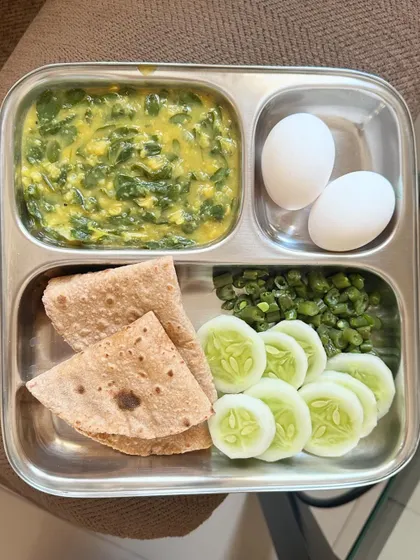 A repeat of the high-protein meal with chapati, dal palak, boiled eggs, and a side of sautéed beans and cucumber.