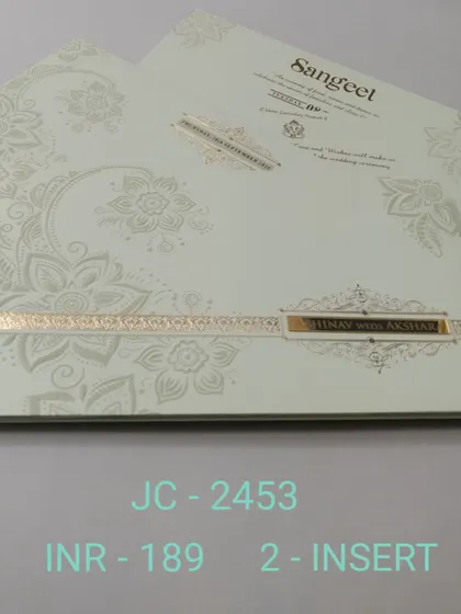 This off-white invitation features a modern, oversized floral pattern embossed in a pearl finish. A simple gold band with the couple's names completes this chic and contemporary design.