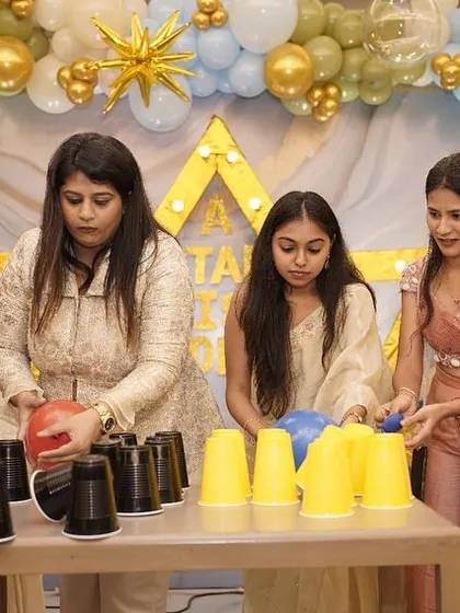 A cup-stacking game using balloons, a simple but challenging and fun activity for guests.