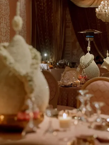 The dining tables were set with gold charger plates and elegant floral centerpieces made from mogra (jasmine). The design is traditional, fragrant, and incredibly beautiful.