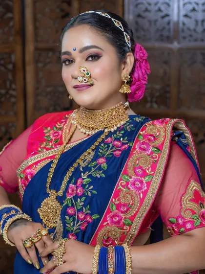 A detailed shot of the eye makeup and the traditional crescent bindi, key elements of a Maharashtrian look.