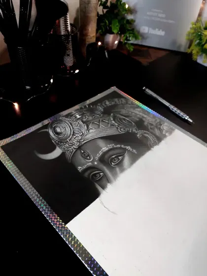 A sneak peek of a hyper-realistic drawing of Matarani. After 14 hours, you can see the eyes and crown emerging from the black background.