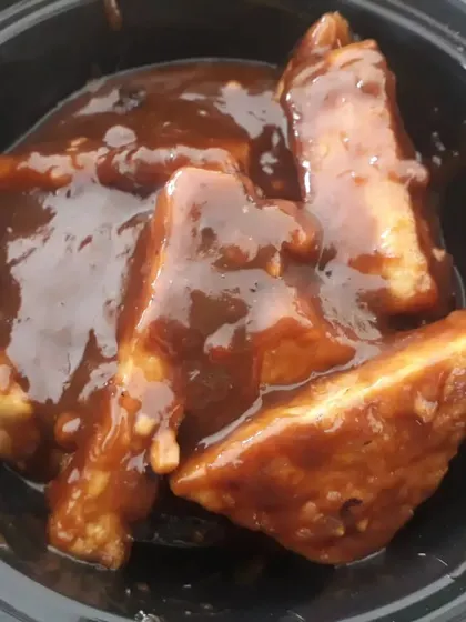 A close-up of the delicious peanut butter tofu, a unique dish inspired by Vietnamese cuisine, made without onion or garlic.
