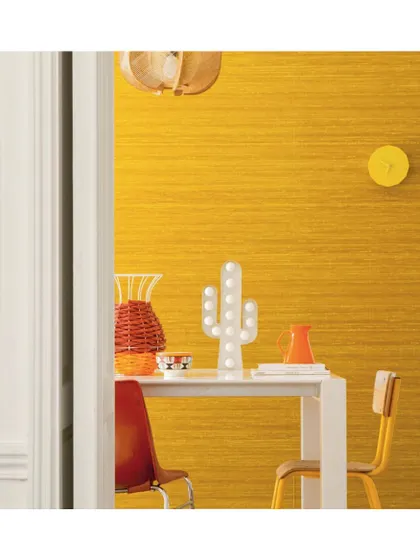 The 'Soie Changeante' wallpaper has a rich, silk-like texture that adds a layer of decadence and glamour. Its subtle sheen and vibrant colour make it a perfect choice for a dining room or accent wall.