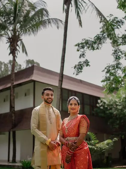 A quiet, intimate portrait framed by lush greenery. We use natural elements to create a sense of romance and tranquility in our couple's wedding photos.