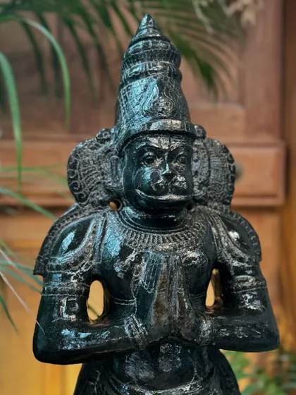This standing Hanuman in Anjali mudra is handcrafted from black granite by artisans in Tamil Nadu. His posture of reverence and devotion makes this statue a wonderful addition to a foyer or a personal zen space.
