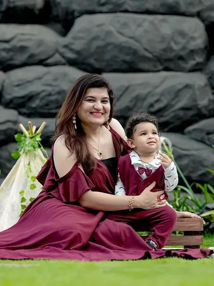 A sweet mother and son portrait. We used our rustic rock wall and props like a teepee and vintage suitcases to create a charming, adventurous theme for their outdoor session.