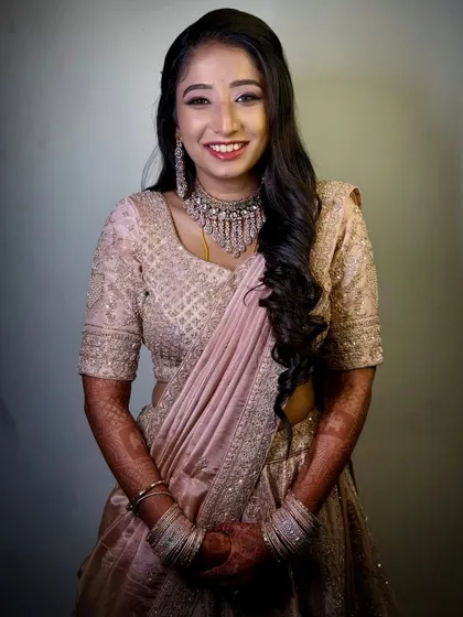 A beautiful portrait of Tina, all smiles for her reception. The HD makeup provides a flawless finish that looks stunning both in person and in high-resolution photos.