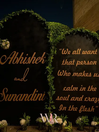 A custom welcome sign that perfectly captures the couple's dynamic: "We all want that person who makes us calm in the soul and crazy in the flesh." It's these personal touches that make a wedding truly unique.