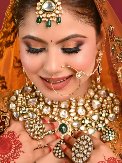 A smiling shot that shows how the makeup looks natural and radiant, not heavy or cakey. Creating a happy bride is the ultimate goal.