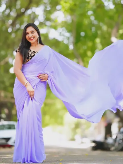 The lavender trail saree in motion, showing the beautiful flow of the fabric.